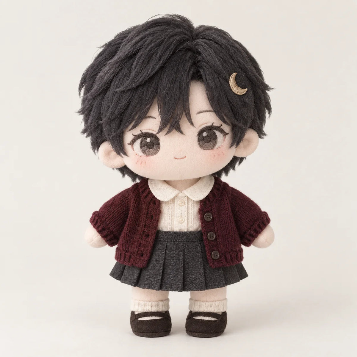 Cotton doll illustration with black hair, a crescent hair clip, a burgundy cardigan and a charcoal skirt.