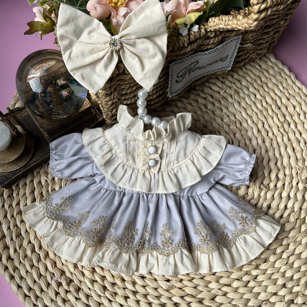 Dove Grey Classic Embroidered Dress & Hair Bow for cotton dolls: lavender-grey dress, cream ruffled collar, cream bow, front view