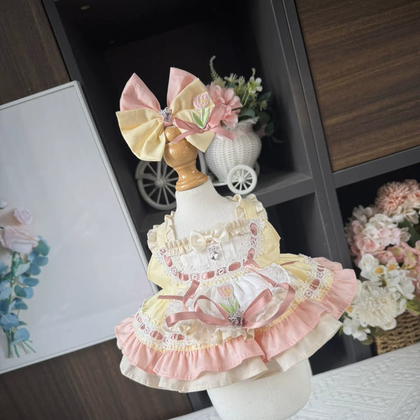 Lemon Tulip Apron Dress & Hair Bow for cotton dolls: yellow and pink dress, tulip apron, ruffles, pink and yellow bow, front view