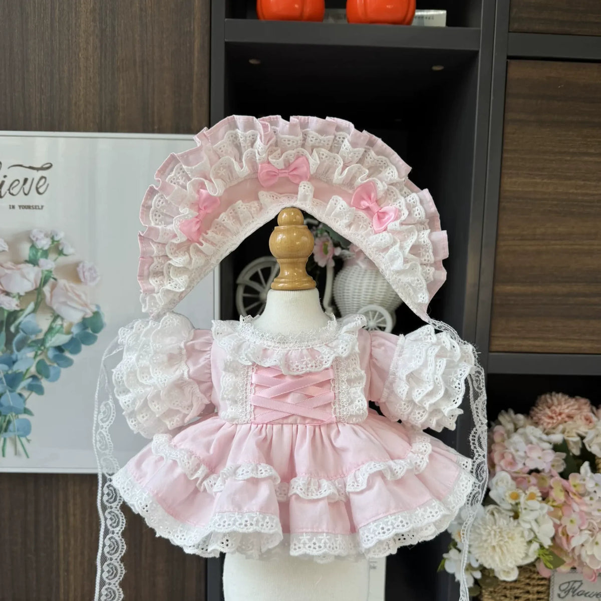 Ballet Pink Lace Dress & Bonnet for cotton dolls: pink lace-up bodice, puff sleeves, eyelet tiers, bow bonnet, front view