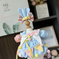 Circus Bunny Dress & Bunny Ear Bow for cotton dolls: light blue dress, pink and blue sleeves, pastel pompoms, bunny ear bow, front view
