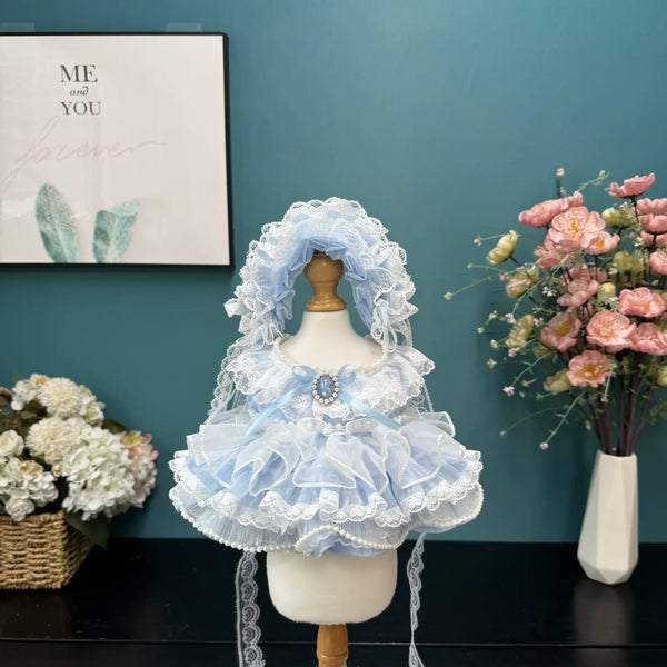 Frosted Cameo Ruffle Dress & Bonnet for cotton dolls: icy blue ruffle tiers, pearl trim, cameo brooch, lace bonnet, front view