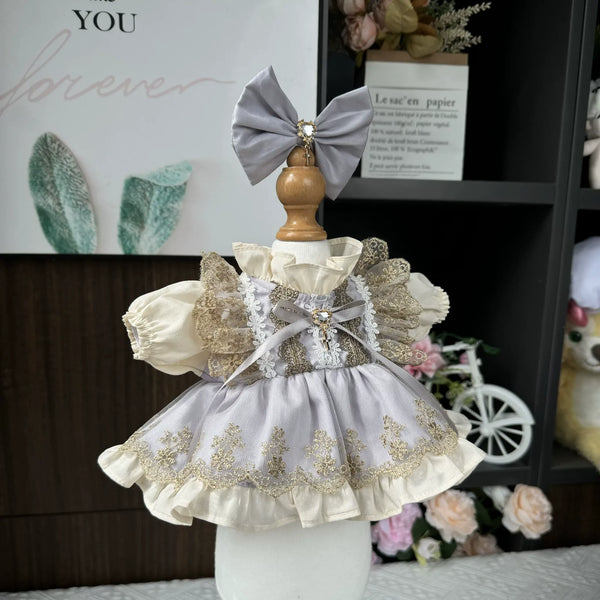Gilded Lilac Embroidered Dress & Hair Bow for cotton dolls: pale lilac dress, gold embroidered lace, grey hair bow, front view