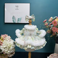 Mint Frost Winter Dress & Hair Bow for cotton dolls: mint print dress, fluffy white trim, jeweled bodice, striped bow, front view