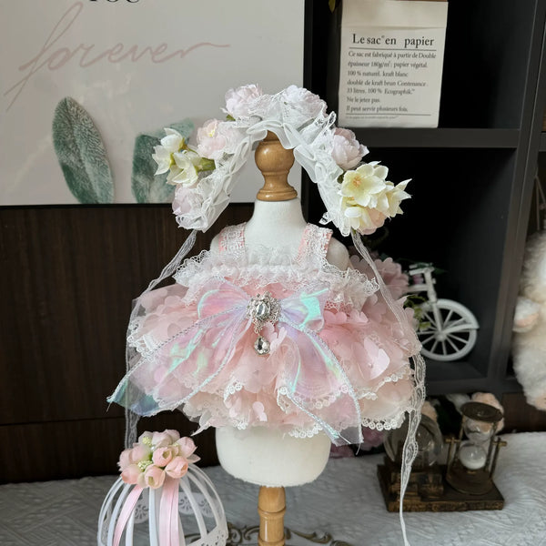 Petal Cloud Ruffle Dress & Flower Crown for cotton dolls: pale pink petal ruffles, iridescent bow, pink and white flower crown, front view