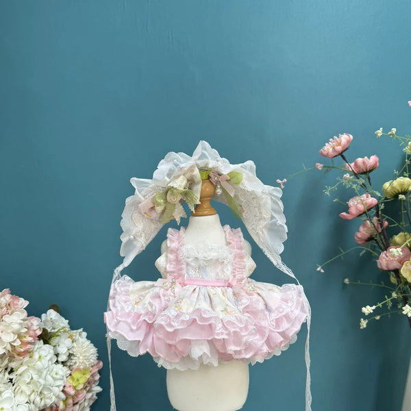 Pink Meringue Ruffle Dress & Bonnet for cotton dolls: pink and white ruffle tiers, lace bib, lace bonnet with flowers, front view