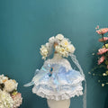 Powder Blue Garland Lace Dress & Flower Crown for cotton dolls: light blue dress, lace tiers, gem brooch, flower crown, front view