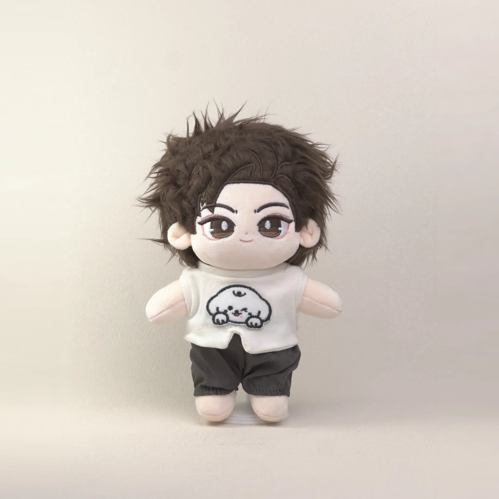 Cotton doll wearing the Puppy Pal outfit: white puppy-patch T-shirt, charcoal shorts and charcoal cap, angled front view