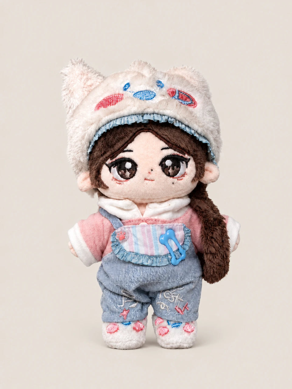 Rain's custom cotton doll standing, in a cat-ear hat and denim overalls