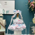 Sky Bonbon Lace Dress & Headdress for cotton dolls: pale blue dress, white ruffles, pink bows, lace hem, blue headdress, front view